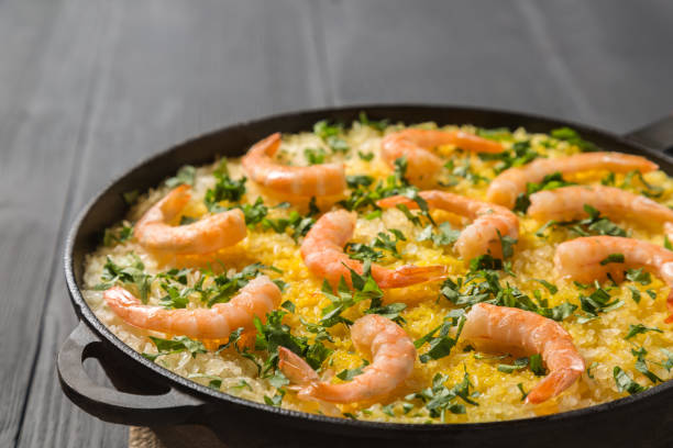 istock Paella with chicken, shrimp and squid rings. Copy-space 952994418