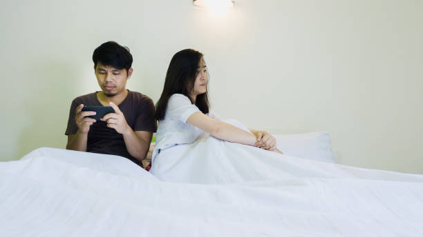 touchy woman angry man playing game on mobile too much touchy woman angry man playing game on mobile too much asian boyfriend too much phone stock pictures, royalty-free photos & images