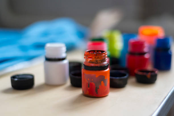 istock Photo of multi-colored jars with acrylic paint 953001960