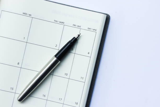 istock Pen on Calendar Planner Isolated on the White Background 953002166