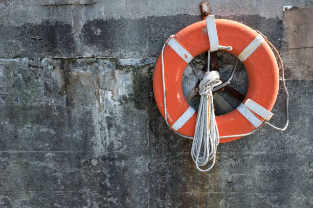 istock Life belt on the wall of a jetty. 953006214