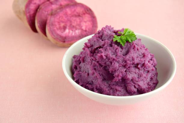 istock Mashed purple yam in a bowl 953007060