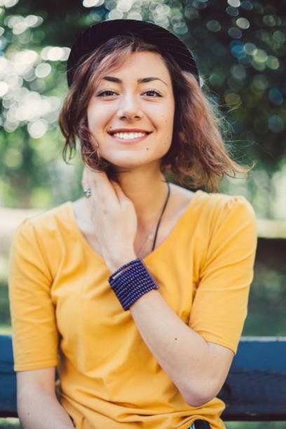 Smiling woman's portrait Happy girl smiling to the camera teenage girls pretty smile looking at camera waist up stock pictures, royalty-free photos & images