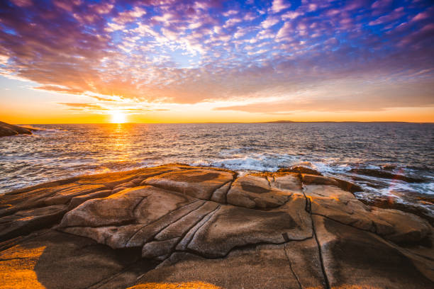 Peggy's cove lighthouse sunset ocean view landscape in Halifax, Nova Scotia stock photo