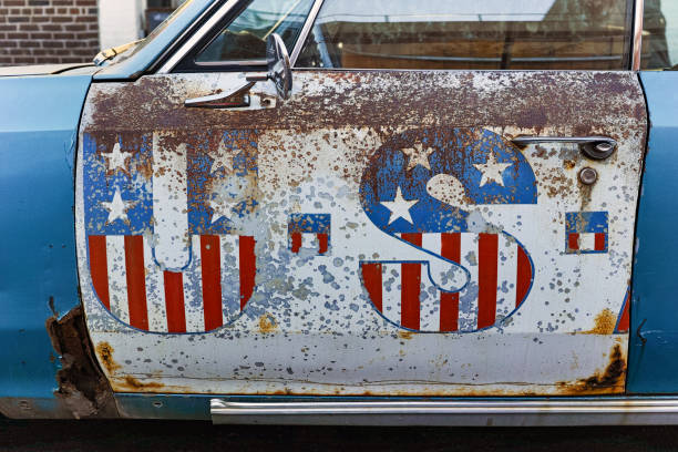 Vintage American cars driving around the streets of Los Angeles, near Manhattan beach.