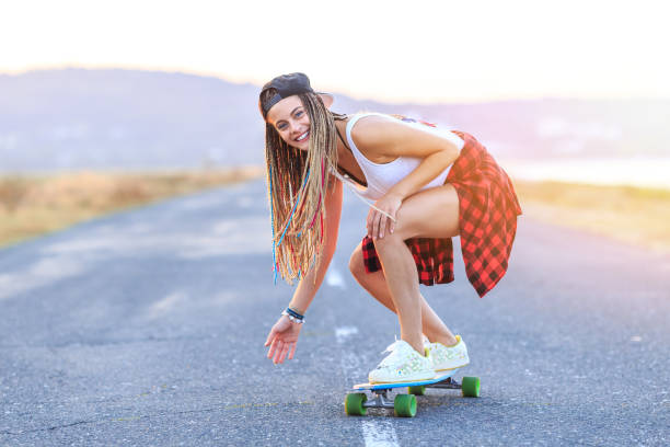 istock Smiling skater moving down on country road 953010568