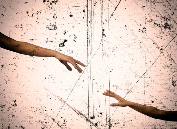 istock grunge style close up hands reaching each other 953011316