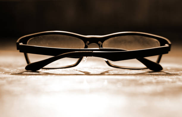 istock Glasses on the ground with sunlight ray from background 953014234