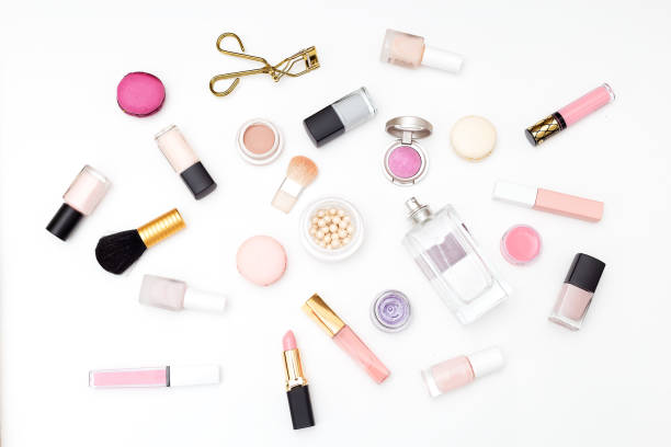 istock Set of cosmetics on a white background and macaroons. Flat lay 953014592