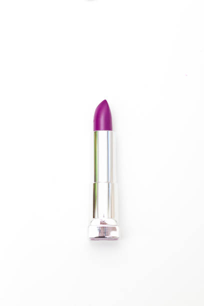 Purple lipstick on a white background. Vertical photo