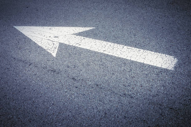 istock Arrow sign on asphalt road 953018790