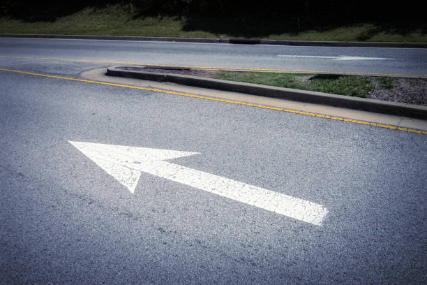 istock Arrow sign on asphalt road 953018898
