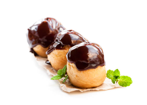 istock Homemade  chocolate profiteroles isolated on white 953023294