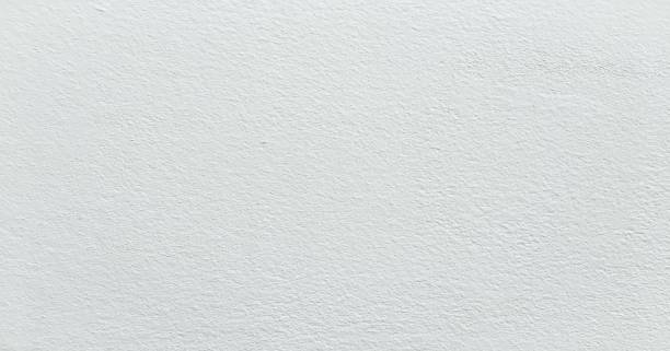 istock Grungy painted wall texture as background. Cracked concrete vintage floor, old white painted. Background washed painting. 953023348