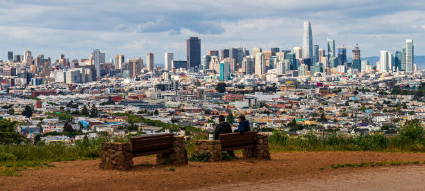 istock Two people enjoying panoramic view of San Francisco urban skyline 953023978