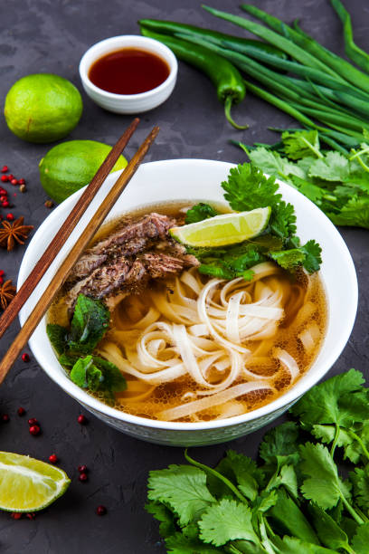 istock Vietnamese Beef Noodle Soup Pho Bo with beef on dark background 953027162
