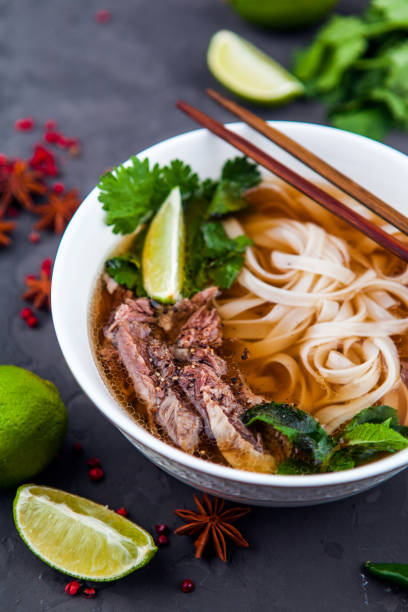 istock Vietnamese Beef Noodle Soup Pho Bo with beef on dark background 953027226