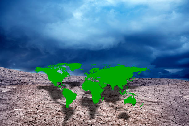 istock conceptual image of cracked landscape with world map 953027512