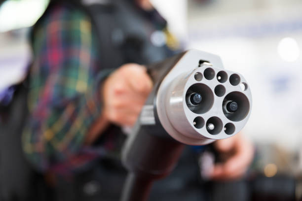 istock Handheld Power plug of electric Car 953031850