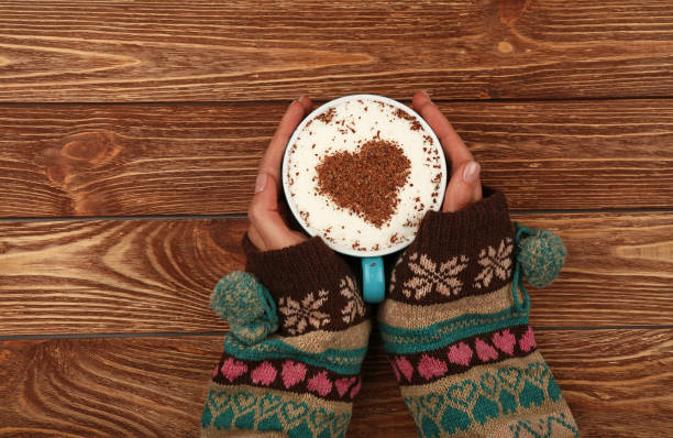 istock Woman hands hold full latte cappuccino coffee cup 953035996