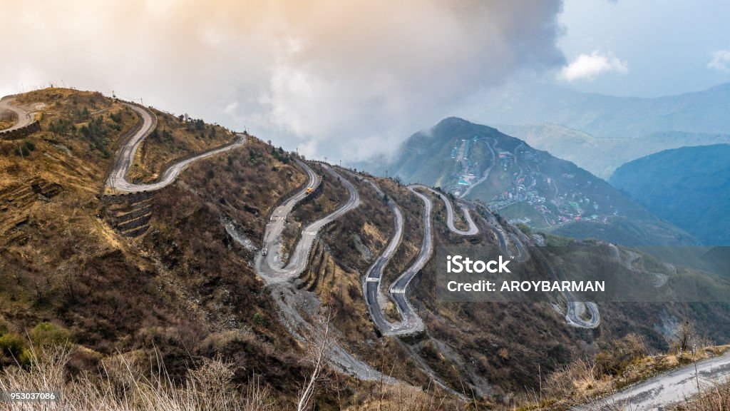 Zigzag road Three Level Zigzag road is probably the most dizzying road in the world. Located in the Sikkim Indian state, in the Himalayan mountains, the road includes more than 100 hairpins in just 30km. Road Stock Photo
