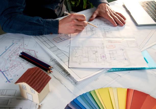 istock Architect working in office with house project on desk 953040754