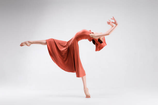 istock Slim beautiful ballerina is posing on a white background 953040940