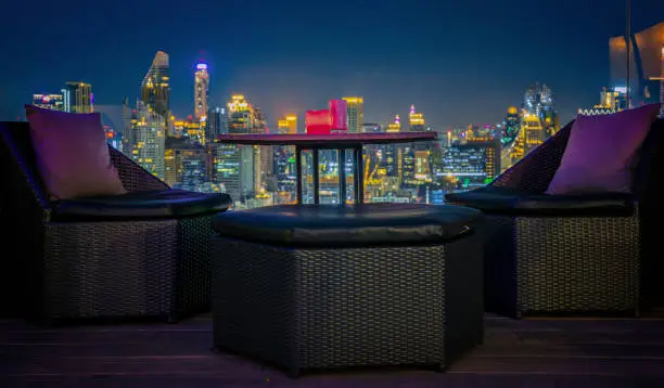 Relax coner in roof top bar and restaurant with bangkok night backgrounf, bangkok, Thailand