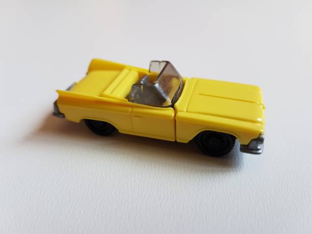 istock yellow retro plastic car isolated toy 953052614