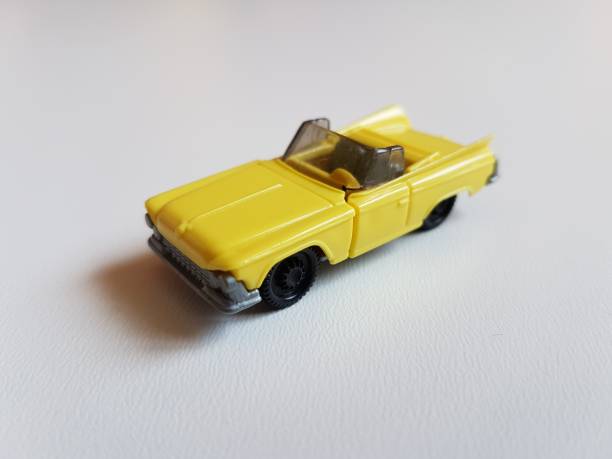 istock yellow retro plastic car isolated toy 953052616