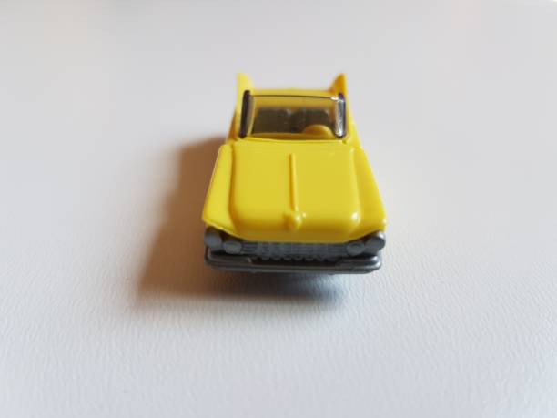 istock yellow retro plastic car isolated toy 953052648
