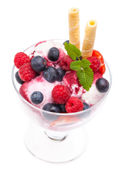 istock real edible fruit ice cream sundae from above on white background 953055890