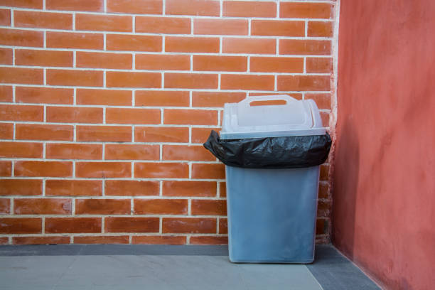 istock Black garbage bags and dirty white bin 953057924