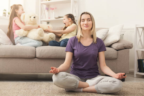 istock Young woman doing yoga exercise at home 953062402