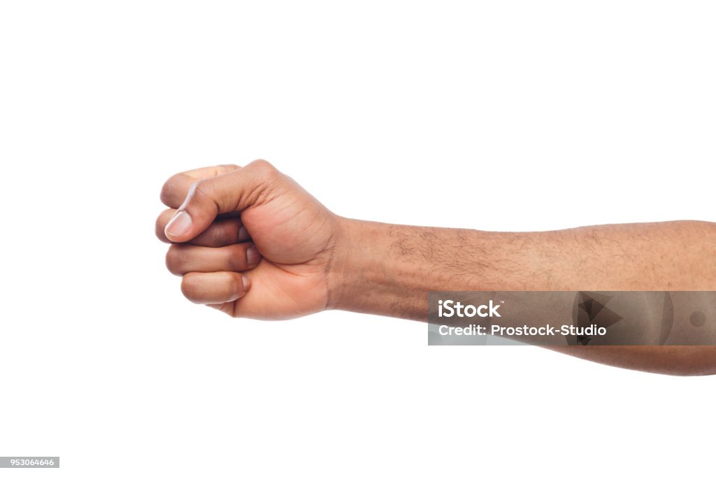 Male black fist isolated on white background Male black fist isolated on white background. African-american clenched hand, gesturing up. Counting, aggression, brave, masculinity concept Fist Stock Photo