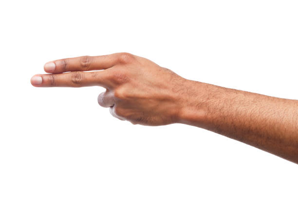 African-american hand holding two fingers outstretched, gun gesture isolated on white studio background