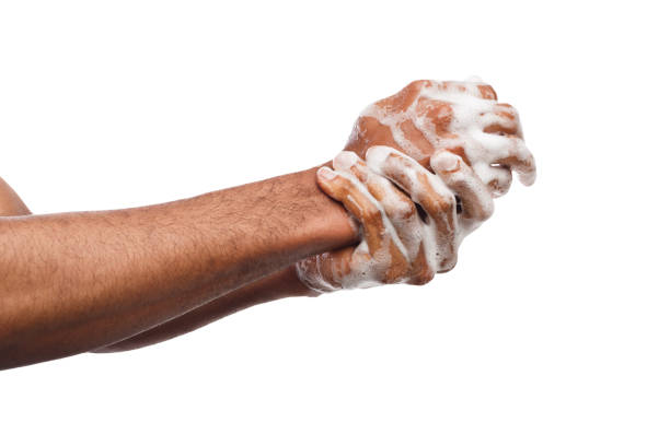 istock Black man washing hands isolated on white background 953064944