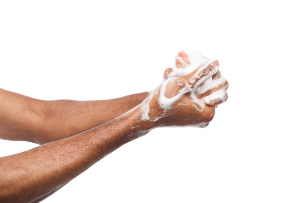 istock Black man washing hands isolated on white background 953064950