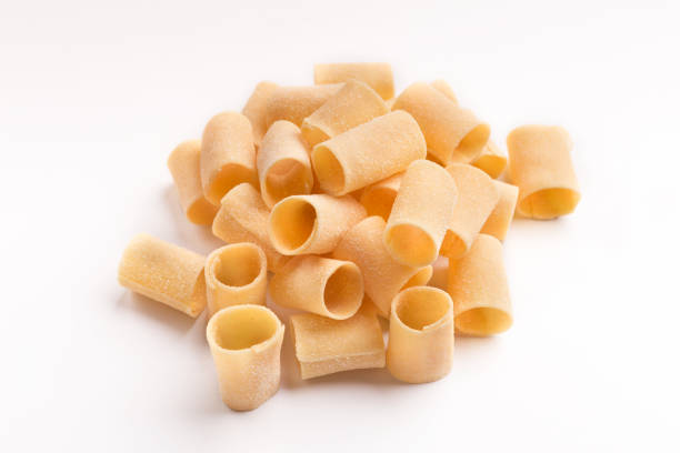 istock Pile of raw paccheri on white background 953065362