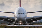 A380 jumbo jet in close front view.