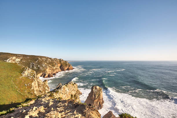 istock Exploring Portugal. Cabo da Roca ocean and mountains view landscape, authentic capture, wanderlust concept. 953069420