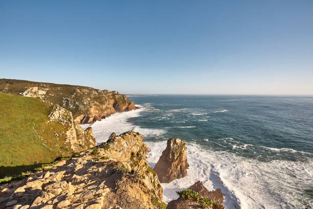 istock Exploring Portugal. Cabo da Roca ocean and mountains view landscape, authentic capture, wanderlust concept. 953069456