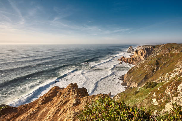 istock Exploring Portugal. Cabo da Roca ocean and mountains view landscape, authentic capture, wanderlust concept. 953069548