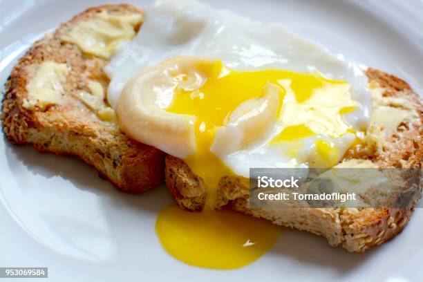 Poached Egg On Toast Stock Photo - Download Image Now - Egg - Food, Toasted Bread, Butter