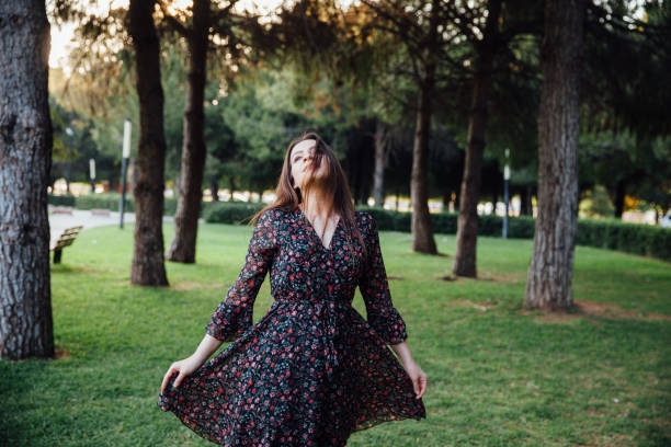 istock Beautiful young woman in park 953071536