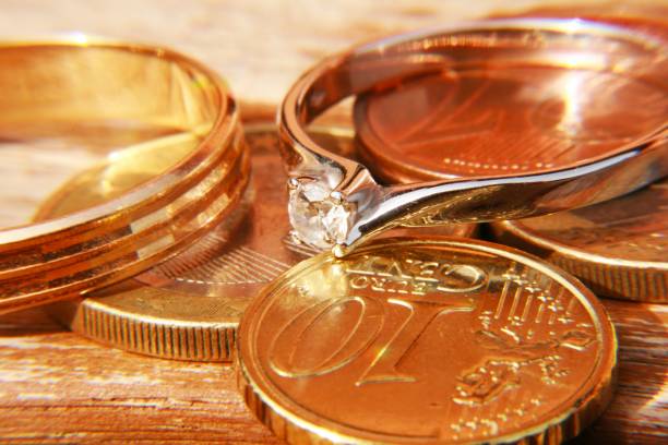 istock Gold rings with coins 953074172