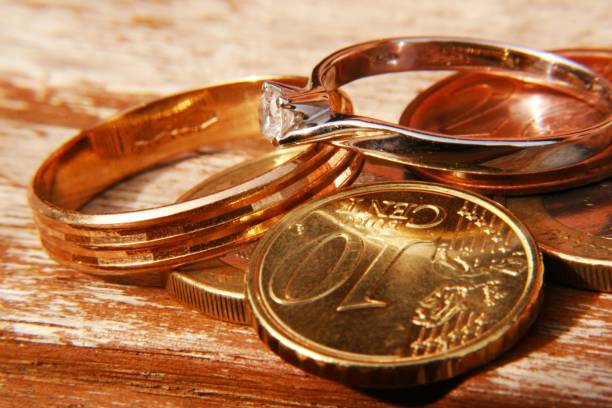 istock Gold rings with coins 953074180