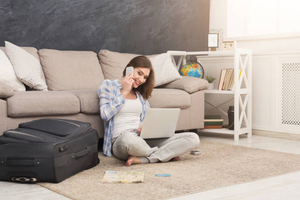 Excited woman planning her annual vacation online