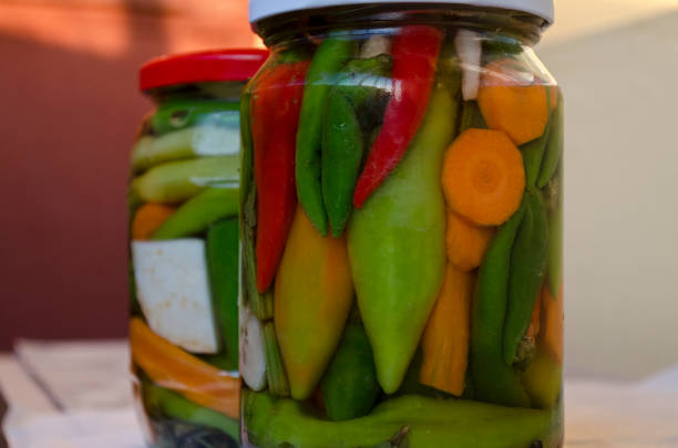 istock Pickled organic vegetables in glass jars 953077664
