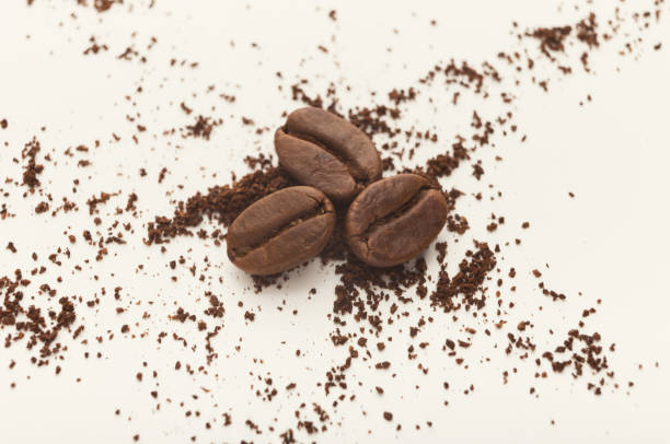 istock Heap of brown coffee beans isolated on white 953081808